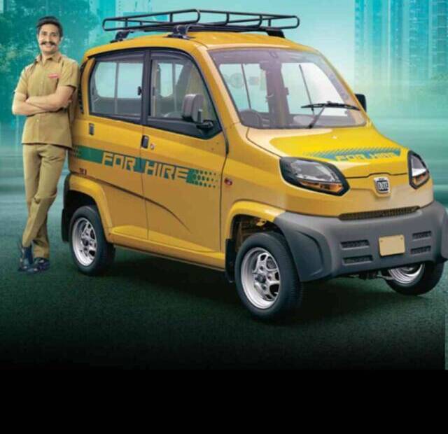 Image of Yellow Bajaj Qute electric car