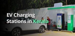a couple charging an electric car in an EV charging hub in Kerala
